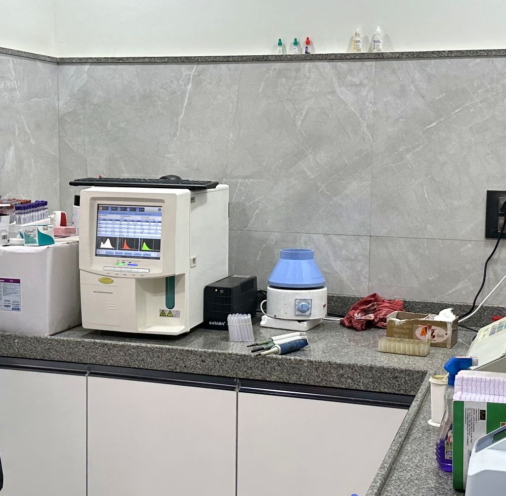 In-house laboratory bench with a haematology analyser and sample tubes